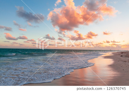 Vibrant colors illuminate a stunning coastal sunset in Dominican Republic 126370745