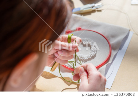cute teenage girl at carpet embroidery workshop, craft exhibition, craft fair, education, workshops, DIY cute teenage girl at carpet embroidery workshop, craft exhibition, craft fair, education, workshops, DIY 126370808
