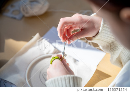 cute teenage girl at carpet embroidery workshop, craft exhibition, craft fair, education, workshops, DIY cute teenage girl at carpet embroidery workshop, craft exhibition, craft fair, education, workshops, DIY 126371254