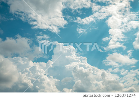 Beautiful cumulus clouds in the blue sky. natural background Beautiful cumulus clouds in the blue sky. natural background 126371274
