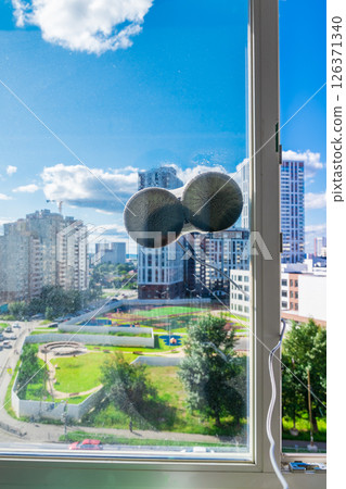 Robot window cleaner washes glass with round rags, robotic service, modern technologies 126371340