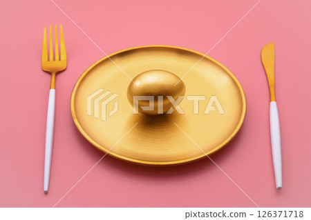 golden egg on golden plate a glistens alongside luxurious cutlery against a vibrant pink background, representing wealth, investment opportunities, and financial success golden egg on golden plate a glistens alongside luxurious cutlery against a vibrant pink background, representing wealth, investment opportunities, and financial success 126371718