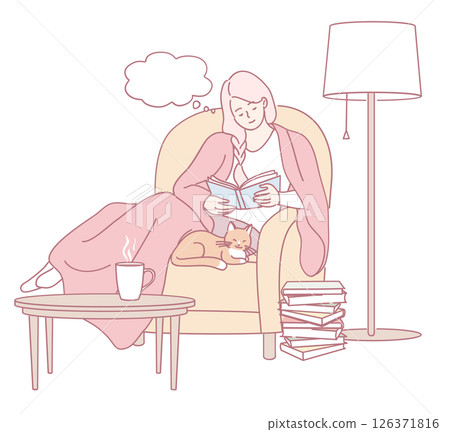 A cozy reading scene featuring a lovely cat nestled in a comfortable chair by the window 126371816