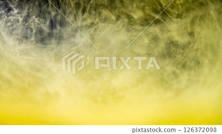 clouds of yellow smoke on a black background, clouds of paint in water, aquarium, abstract background, texture clouds of yellow smoke on a black background, clouds of paint in water, aquarium, abstract background, texture 126372098