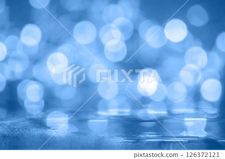 Soft, gentle, shimmering blue bokeh. Rich warm shifting light elements against a gold background. Soft, gentle, shimmering blue bokeh. Rich warm shifting light elements against a gold background. 126372121