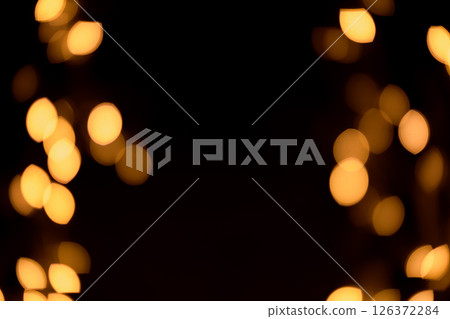 Bright yellow, gold lights, bokeh on black background Bright yellow, gold lights, bokeh on black background 126372284