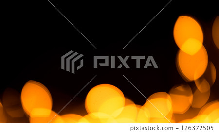 Bright yellow, gold lights, bokeh on black background Bright yellow, gold lights, bokeh on black background 126372505