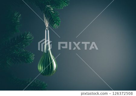 Elegant green christmas ornament hanging from a natural pine branch, creating a festive atmosphere against a dark background, perfect for holiday decorations and seasonal greetings Elegant green christmas ornament hanging from a natural pine branch, creating a festive atmosphere against a dark background, perfect for holiday decorations and seasonal greetings 126372508