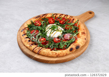 Burrata Arugula Pizza with Cherry Tomatoes Pesto and Balsamic Drizzle Burrata Arugula Pizza with Cherry Tomatoes Pesto and Balsamic Drizzle 126372829