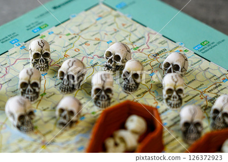 Many skulls on the map of Ukraine near the inscription Sumy, Kharkov, a symbol of victims of war 126372923