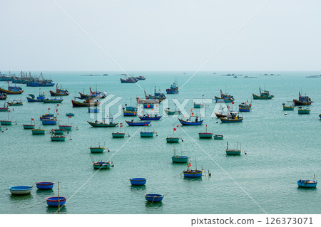 Many small fishing vessels and boats on the coast of the South China Sea in Mui Ne, Vietnam 126373071