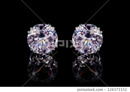 earrings silver, gold with stone morganite, diamonds on black background earrings silver, gold with stone morganite, diamonds on black background 126373152