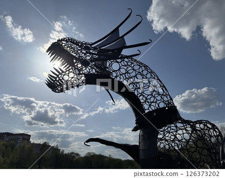 Fierce Metal Dragon Sculpture Biting Toward the Sun 126373202