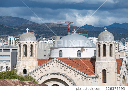 Holy Trinity church with a red tile roof and white stucco walls stands in the middle of Limassol Old Town, Cyprus 126373393