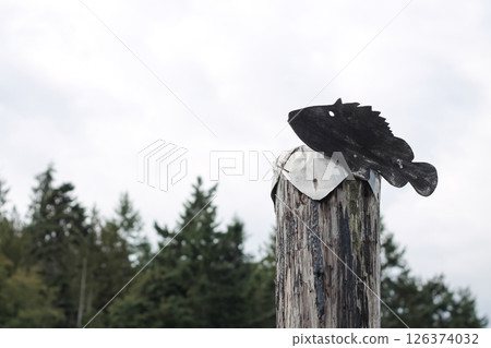 Wooden Fish Silhouette Shape Attached To A Post At The Docks 126374032