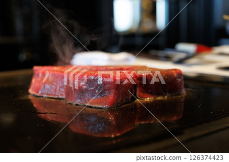 Bake a steak 126374423