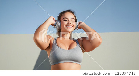 Plus size woman focused on training with battle ropes in the gym, showcasing strength and determination. Generated image 126374715