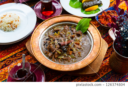 Mutancana from lamb with dried fruits, honey and almonds Mutancana from lamb with dried fruits, honey and almonds 126374804