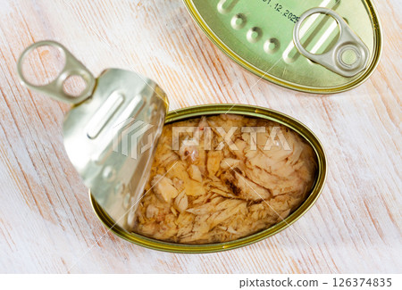 Glass jar with canned tuna in oil 126374835