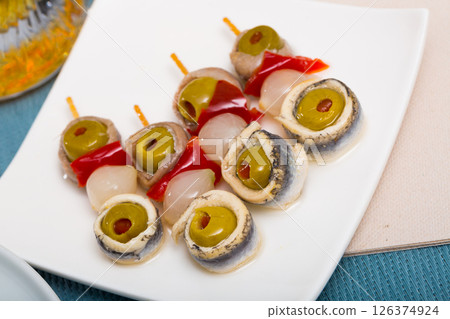 Salted anchovies with olives, bell pepper, onion 126374924