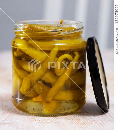 Canned green chili peppers in jar Canned green chili peppers in jar 126375065