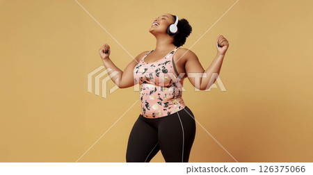Plus size woman focused on training with battle ropes in the gym, showcasing strength and determination. Generated image 126375066