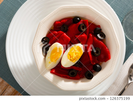 Andalusian roasted pepper salad with boiled egg and olives 126375199