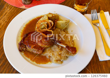 Confit du canard in czech with sauerkraut and potato dumplings Confit du canard in czech with sauerkraut and potato dumplings 126375460
