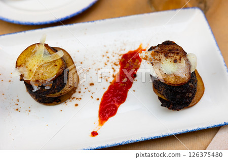 Timbale of pear and cheese blood sausage. Traditional dish for the region of Salamanca and Zaragoza Timbale of pear and cheese blood sausage. Traditional dish for the region of Salamanca and Zaragoza 126375480