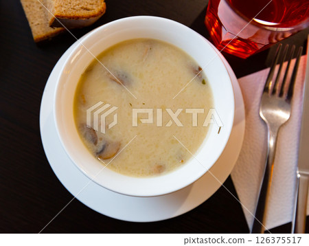 Popular dish of Russian cuisine is mushroom soup 126375517