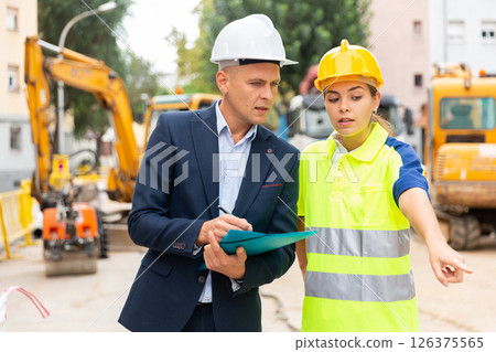 Engineers discussing in construction plant Engineers discussing in construction plant 126375565
