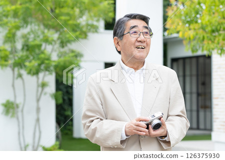 Senior man, camera, travel Senior man, camera, travel 126375930