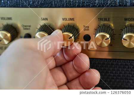 Guitar amplifier closeup, cable connected 126376050