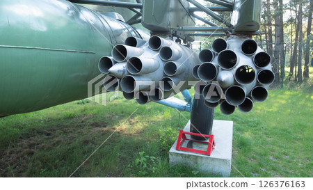 A vintage missile launcher in a natural setting showcases Soviet-era technology, emphasizing military history and engineering marvels. 126376163