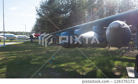 Soviet-era aircraft and missiles are on display in a museum, highlighting historical engineering and design from the USSR period in Russia. Soviet-era aircraft and missiles are on display in a museum, highlighting historical engineering and design from the USSR period in Russia. 126376172