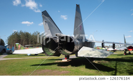 Soviet fighter jets rest under a clear blue sky at an aviation exhibition in Russia, highlighting the engineering and design of Cold War-era military aircraft. Soviet fighter jets rest under a clear blue sky at an aviation exhibition in Russia, highlighting the engineering and design of Cold War-era military aircraft. 126376184