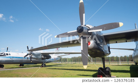 Soviet-era planes stand in a row at an outdoor aviation museum in Russia, showcasing their retro design and unique engineering for aviation enthusiasts. Soviet-era planes stand in a row at an outdoor aviation museum in Russia, showcasing their retro design and unique engineering for aviation enthusiasts. 126376185