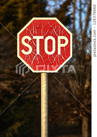 Stop sign with broken paint peeling Stop sign with broken paint peeling 126376668