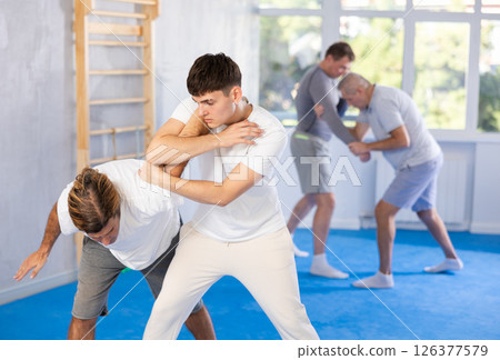 Two men training judo technique in studio 126377579
