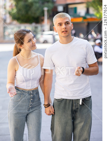guy with his girlfriend walking around the city guy with his girlfriend walking around the city 126377614