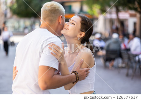 Friends met after long separation, greet and hug Friends met after long separation, greet and hug 126377617