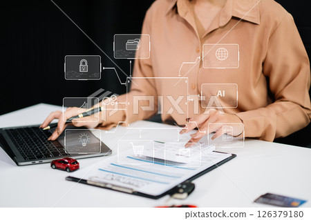 Asian people car salesman or sales manager offers to sell a car and explains of signing a car contract and signing car Asian people car salesman or sales manager offers to sell a car and explains of signing a car contract and signing car 126379180