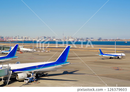A plane heading for the runway and the Skytree beyond A plane heading for the runway and the Skytree beyond 126379603