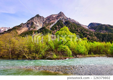 Azusa River and Hotaka mountain range in the Northern Alps with fresh greenery Azusa River and Hotaka mountain range in the Northern Alps with fresh greenery 126379802