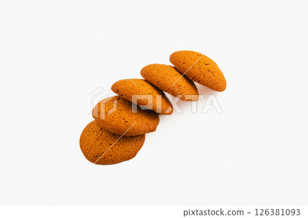 Freshly baked cookies arranged in a neat line on white surface 126381093