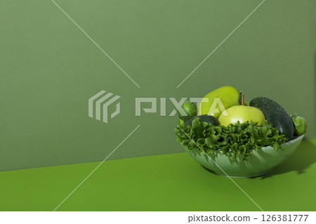Set of protein vegetables in bowl on green background, space for text Set of protein vegetables in bowl on green background, space for text 126381777