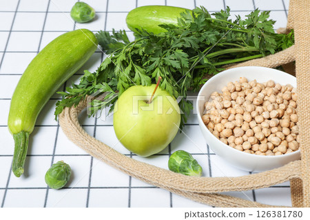 Set of vegan protein products in bowl and bag on light background, close up Set of vegan protein products in bowl and bag on light background, close up 126381780