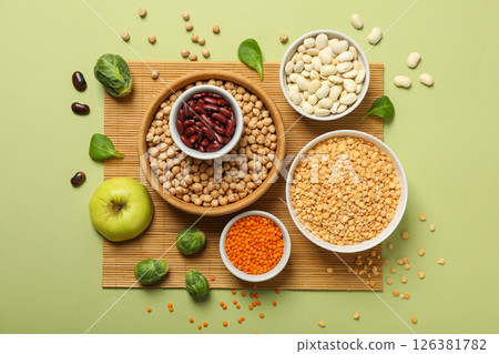 Protein vegetable and bean in bowl on green background, top view Protein vegetable and bean in bowl on green background, top view 126381782