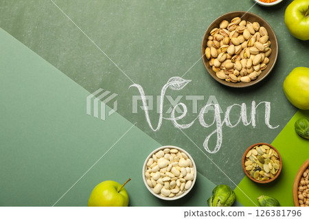 Set of protein products in bowls, female hands and word Vegan on green background, space for text 126381796