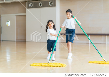 Girl cleaning the gym 126382247